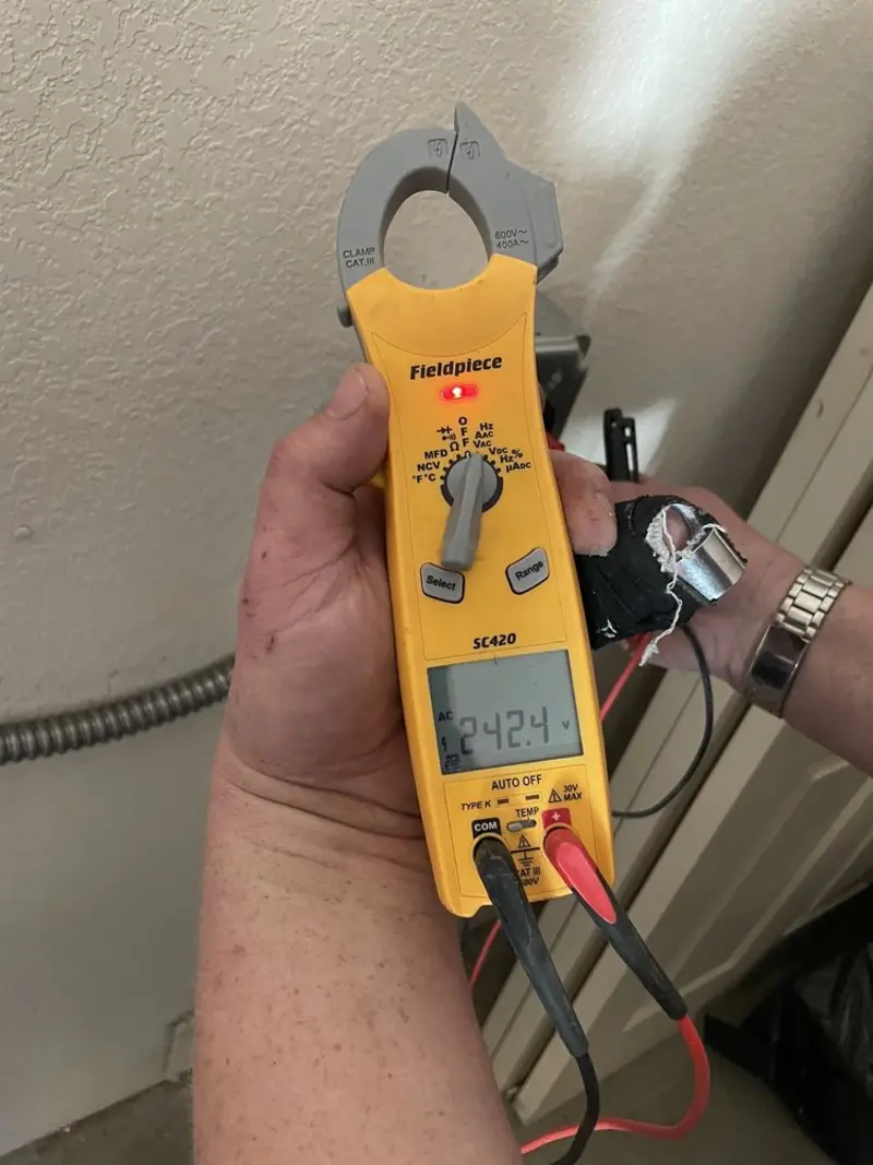 Voltage testing with clamp meter during Outlet Installation in Forward